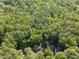 Overhead angle of homes surrounded by forest and lush landscaping at 128 Cobblestone Dr, Chapel Hill, NC 27516
