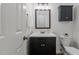 Bathroom featuring a vanity with storage, a sink with a mirror, and a toilet at 128 Cobblestone Dr, Chapel Hill, NC 27516