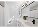 Modern bathroom featuring a dual sink vanity and black hardware at 128 Cobblestone Dr, Chapel Hill, NC 27516