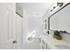Bright bathroom featuring a dual sink vanity, black hardware, and stylish decor at 128 Cobblestone Dr, Chapel Hill, NC 27516