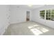 Neutral bedroom with carpet, white walls, and natural light from a window at 128 Cobblestone Dr, Chapel Hill, NC 27516