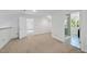 Bright bedroom featuring neutral carpet and an adjoining bathroom with a glass shower at 128 Cobblestone Dr, Chapel Hill, NC 27516