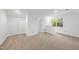 Bright bedroom featuring neutral carpet, a large window and closet for plenty of storage space at 128 Cobblestone Dr, Chapel Hill, NC 27516