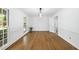 Open dining room featuring hardwood floors and natural light at 128 Cobblestone Dr, Chapel Hill, NC 27516