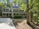 Charming two-story home with a welcoming front porch and lush greenery at 128 Cobblestone Dr, Chapel Hill, NC 27516