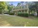 Traditional-style home with covered porch and manicured lawn at 128 Cobblestone Dr, Chapel Hill, NC 27516