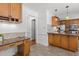The kitchen features granite countertops, wood cabinets and opens to an adjacent room at 128 Cobblestone Dr, Chapel Hill, NC 27516