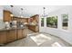 Modern kitchen with a large island, granite counters, and ample natural light at 128 Cobblestone Dr, Chapel Hill, NC 27516