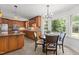Bright eat-in kitchen features stainless appliances, granite countertops, tile backsplash, and a breakfast area at 128 Cobblestone Dr, Chapel Hill, NC 27516