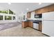 Bright kitchen featuring a breakfast bar, stainless appliances, and plenty of natural light at 128 Cobblestone Dr, Chapel Hill, NC 27516