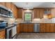 Well-equipped kitchen featuring granite countertops, stainless steel appliances and an eat-in area at 128 Cobblestone Dr, Chapel Hill, NC 27516