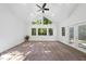 Bright open living room featuring a high ceiling and many windows at 128 Cobblestone Dr, Chapel Hill, NC 27516