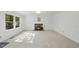 Cozy living room featuring a traditional fireplace and natural light at 128 Cobblestone Dr, Chapel Hill, NC 27516