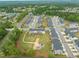 This aerial shot features a Gathering friendly neighborhood with a playground and green space at 138 Boarstall Crk, Durham, NC 27707