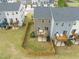 Aerial view of the backyard, decks, patios, grassy areas, and surrounding neighborhood at 138 Boarstall Crk, Durham, NC 27707