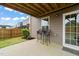 Back patio features outdoor seating, a grassy area, and a view of the neighboring homes at 138 Boarstall Crk, Durham, NC 27707