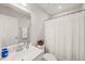 Neat bathroom featuring a shower with a white curtain, and a white sink at 138 Boarstall Crk, Durham, NC 27707