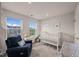 Bright Bedroom with a crib, comfortable seating, and cheerful decor at 138 Boarstall Crk, Durham, NC 27707