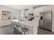Modern kitchen with a large island, stainless steel appliances, and white cabinets at 138 Boarstall Crk, Durham, NC 27707