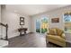 Comfortable living room with hardwood floors, lots of light, and a sliding glass door to the backyard at 138 Boarstall Crk, Durham, NC 27707
