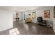 Spacious living room with hardwood floors, comfortable seating, a sliding glass door, and a desk at 138 Boarstall Crk, Durham, NC 27707