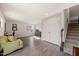 Spacious living room with hardwood floors, comfortable seating, staircase, and plenty of natural light at 138 Boarstall Crk, Durham, NC 27707