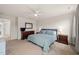 Spacious main bedroom with carpeted floors, a ceiling fan, and a coordinated furniture set at 138 Boarstall Crk, Durham, NC 27707