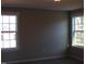 Cozy bedroom featuring two large windows for natural light at 1403 Reading Ct # 75 Kl, Burlington, NC 27217