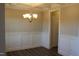 An empty dining room features white trim and a modern chandelier at 1403 Reading Ct # 75 Kl, Burlington, NC 27217