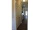 Hallway view of the kitchen featuring modern cabinets and stainless steel appliances at 1403 Reading Ct # 75 Kl, Burlington, NC 27217