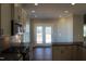 Kitchen featuring modern cabinets, stainless steel appliances, and double doors leading to a deck at 1403 Reading Ct # 75 Kl, Burlington, NC 27217