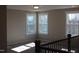Sun-drenched landing with large windows and carpeted floor at 1403 Reading Ct # 75 Kl, Burlington, NC 27217