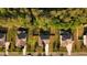 Birds-eye view of neighborhood with tree-lined streets and well-maintained lawns showing rooftops and driveways at 144 Elk Stone Trl, Garner, NC 27529