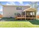 Back exterior of the home featuring a wood deck and large screened porch at 144 Elk Stone Trl, Garner, NC 27529