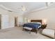 Spacious main bedroom with tray ceiling, ample natural light, and an attached bathroom at 144 Elk Stone Trl, Garner, NC 27529