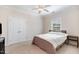 Bedroom with carpet, a bed, and double doors leading to closet space at 144 Elk Stone Trl, Garner, NC 27529