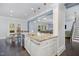 Open concept kitchen featuring an island with granite countertops, stainless steel appliances, and open sightlines at 144 Elk Stone Trl, Garner, NC 27529