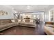 Spacious living room featuring hardwood floors and seamlessly flowing into the adjacent kitchen and dining area at 144 Elk Stone Trl, Garner, NC 27529