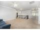 Upstairs loft featuring plush carpet, neutral paint, and wrought iron staircase at 144 Elk Stone Trl, Garner, NC 27529