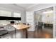 Well-lit home office featuring a stand-up desk and view into sitting room at 144 Elk Stone Trl, Garner, NC 27529