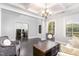 Inviting living room with coffered ceilings, neutral walls, and view into office at 144 Elk Stone Trl, Garner, NC 27529