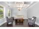 Inviting living room with coffered ceilings, neutral walls, and hardwood floors at 144 Elk Stone Trl, Garner, NC 27529
