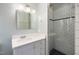 Updated bathroom featuring a glass enclosed shower with subway tile, a stylish mirror, and modern lighting at 1506 Ephesus Church Rd, Chapel Hill, NC 27517