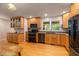 Bright kitchen featuring granite countertops, stainless steel appliances, and hardwood floors at 1506 Ephesus Church Rd, Chapel Hill, NC 27517