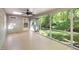 Covered back porch with a ceiling fan, wood flooring, and screened openings for enjoying the outdoors at 1506 Ephesus Church Rd, Chapel Hill, NC 27517