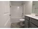 This bathroom features a shower/tub combo and vanity with gray cabinets at 1590 Pecan Drive # 45, Nashville, NC 27856