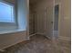 Bright bathroom features a separate shower and tub, with gray tile flooring at 1590 Pecan Drive # 45, Nashville, NC 27856