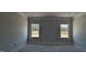 Bedroom features large windows, neutral color palette, and decorative molding at 1590 Pecan Drive # 45, Nashville, NC 27856