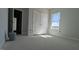 Spacious bedroom with white trim, walk-in closet, and natural light coming from the window at 1590 Pecan Drive # 45, Nashville, NC 27856