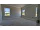 A bright bedroom with large windows, neutral color palette, and decorative molding at 1590 Pecan Drive # 45, Nashville, NC 27856